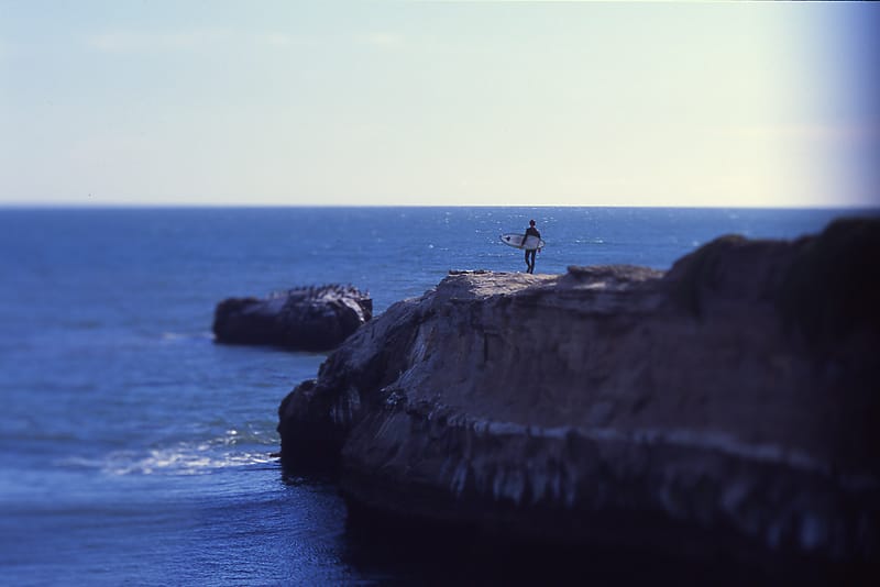 Surfer on the Rocks